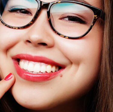 A smiling lady wearing glasses