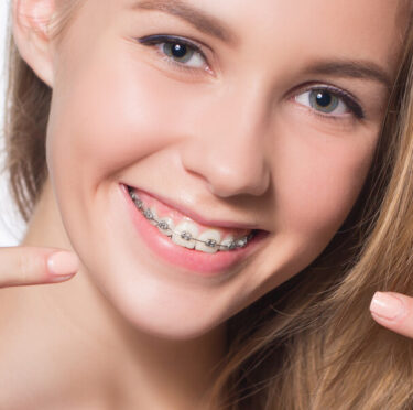 girl with traditional braces