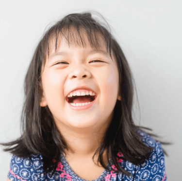 A cute little girl laughing